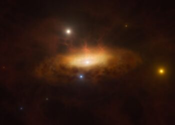 Καλλιτεχνική απεικόνιση που δείχνει τον αυξανόμενο δίσκο υλικού που έλκεται από τη μαύρη τρύπα και κάνει τον γαλαξία να λάμπει (φωτ.: ESO/M. Kornmesser)